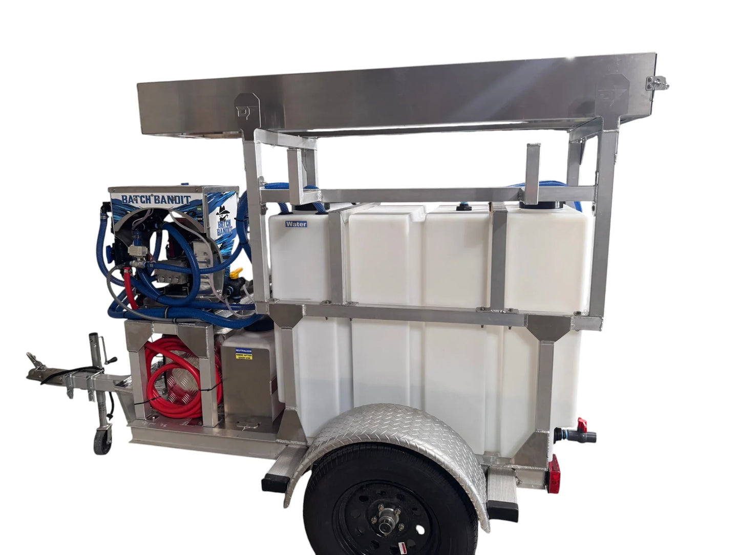 Mobile softwash trailer with water tanks, hoses, and cleaning equipment for professional exterior cleaning