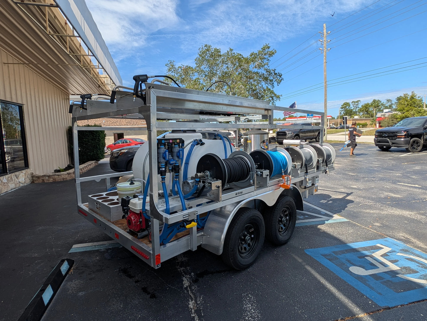 Professional softwash trailer with tanks, hoses, and pressure washers for exterior cleaning services