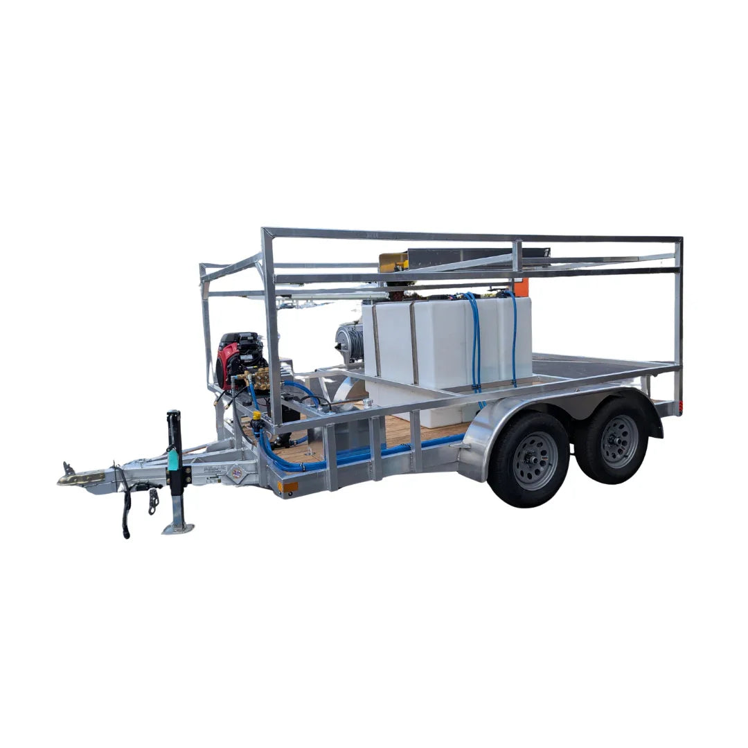 Softwash trailer with pressure washer, chemical tanks, and hose reels for professional exterior cleaning