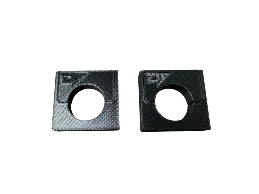 Black 3D printed softwash equipment mounts with circular cutouts for secure pipe fitting