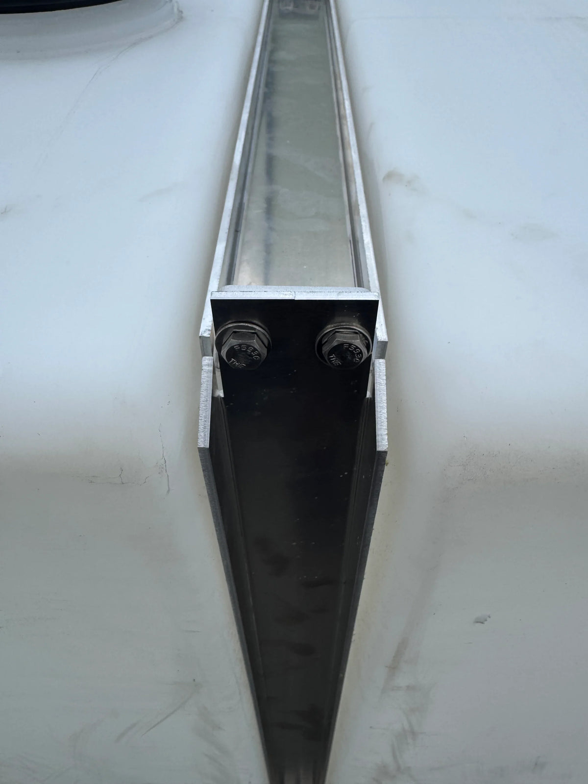 Aluminum softwash equipment rail with mounting bolts, designed for professional cleaning systems.