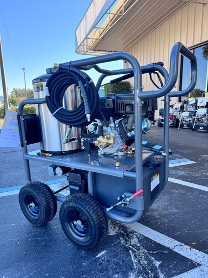Pressure washer on wheels in a parking lot with a building in the background