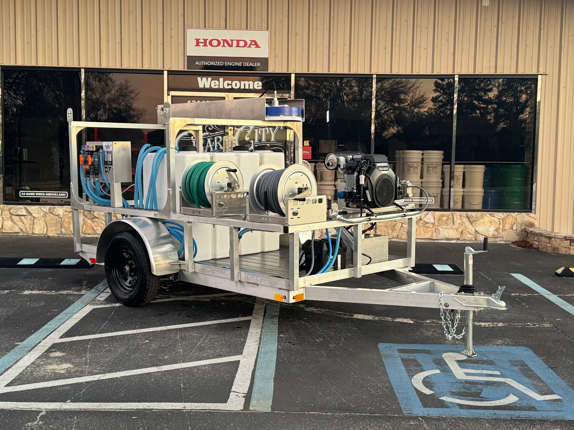 Professional softwash trailer with Honda engine, hoses, and tanks for exterior cleaning services