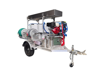 Professional softwash trailer with pressure washer, hoses, and chemical tanks for exterior cleaning