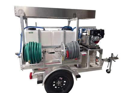 Professional softwash trailer with chemical tanks, hoses, and pressure washer for exterior cleaning