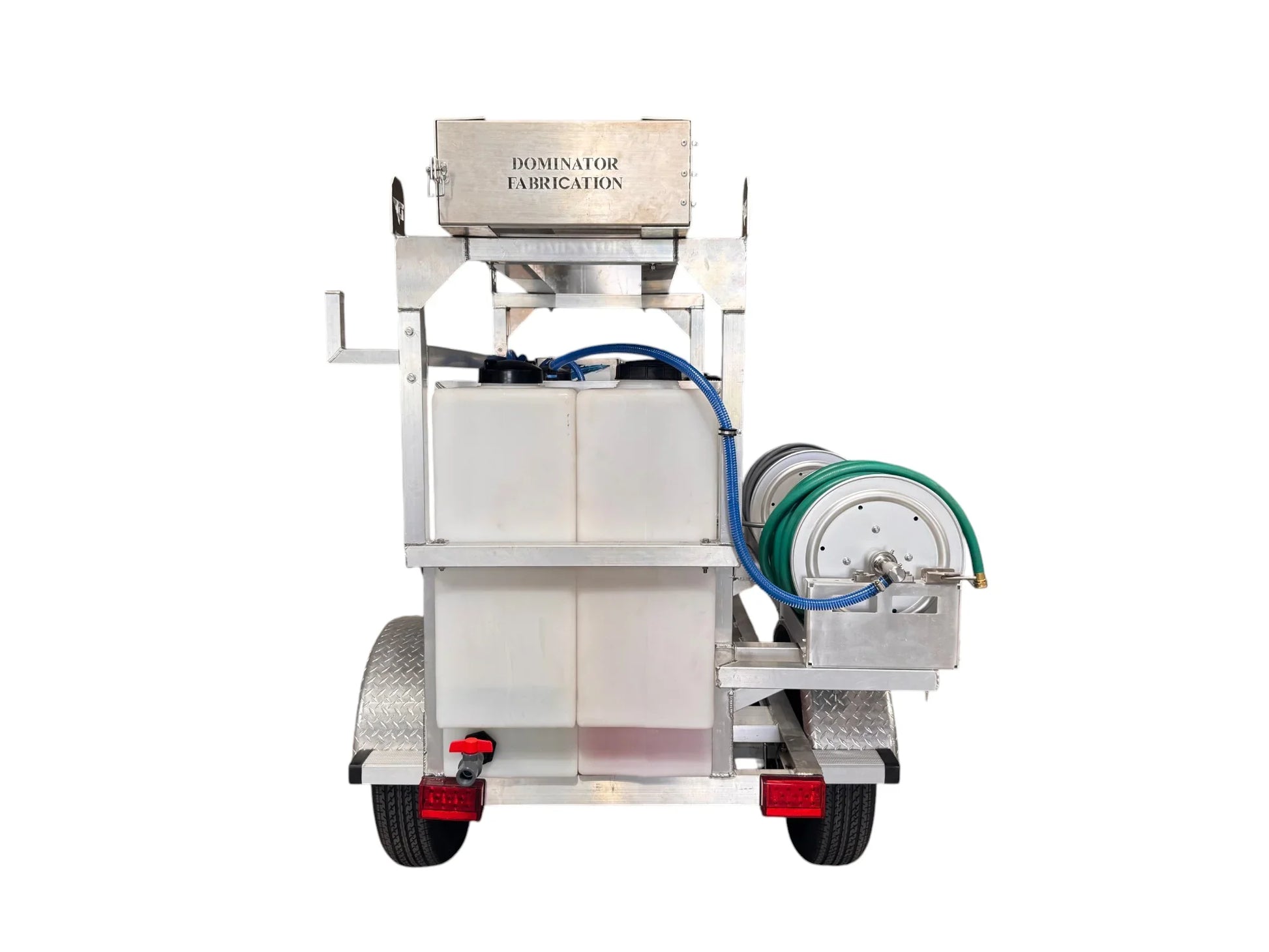 Softwash trailer with tanks, hoses, and Dominator Fabrication branding for professional cleaning equipment