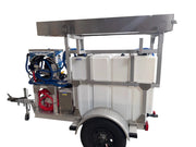 Mobile softwash trailer with water tanks, hoses, and cleaning equipment for professional exterior cleaning