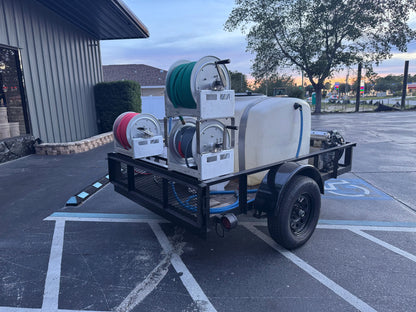 Mobile softwash trailer with Dominator hose reels, tank, and pump for exterior cleaning solutions