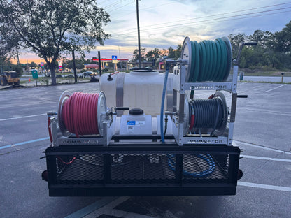 Softwash equipment with coiled hoses and tank, ideal for professional cleaning solutions.