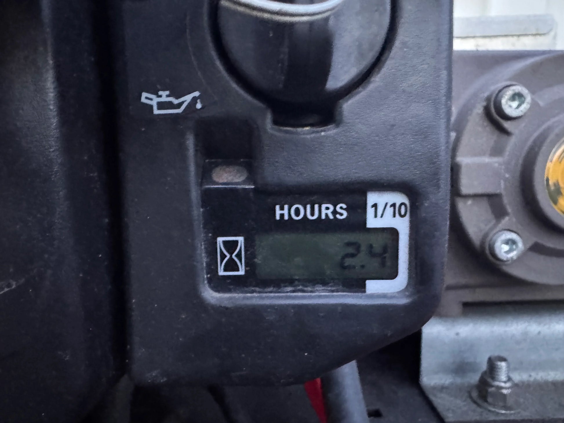 Digital hour meter showing 2.4 hours on softwash equipment