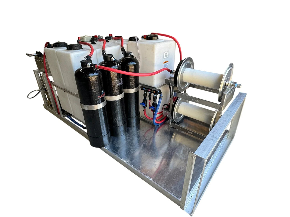 Professional softwash equipment with tanks, hoses, and Titan reels for pressure washing systems