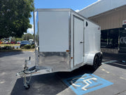 White enclosed utility trailer with diamond plate accents, ideal for softwash equipment transport