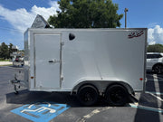 White NXT softwash trailer parked in lot, ideal for professional cleaning equipment transport.