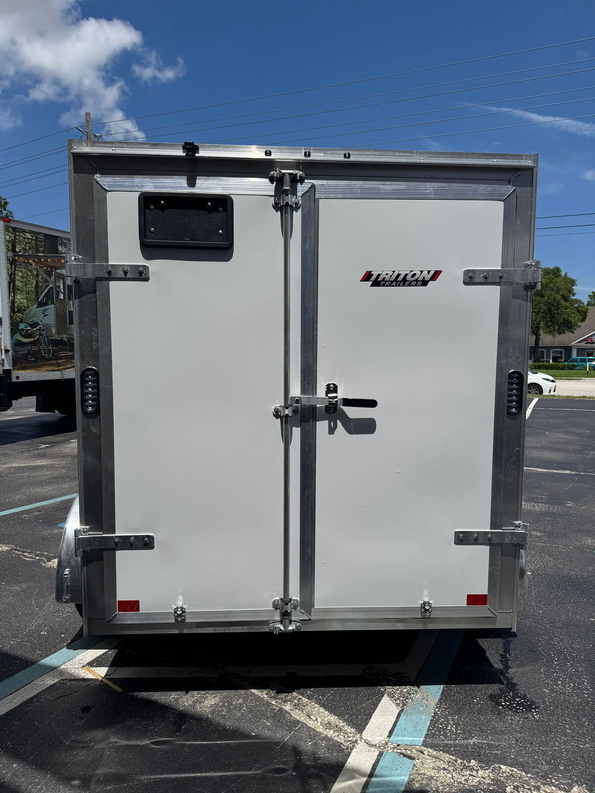 Triton Trailers softwash equipment storage unit with secure locking doors and LED lights