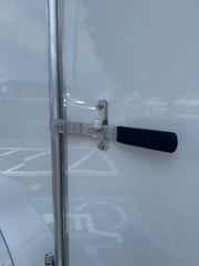 Sturdy metal latch with black handle on white softwash equipment door