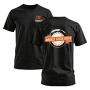 Black t-shirt with 'Market Fresh Skids' graphic and 'Dominator Fabrication' logo, featuring orange and white design.