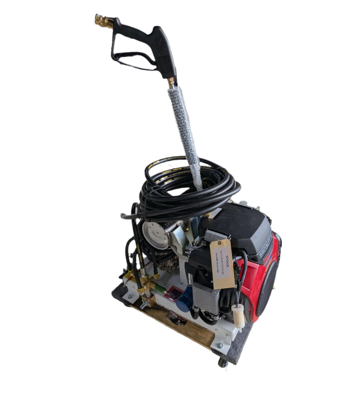 Professional softwash pressure washer with Honda engine, hose, and spray gun for exterior cleaning