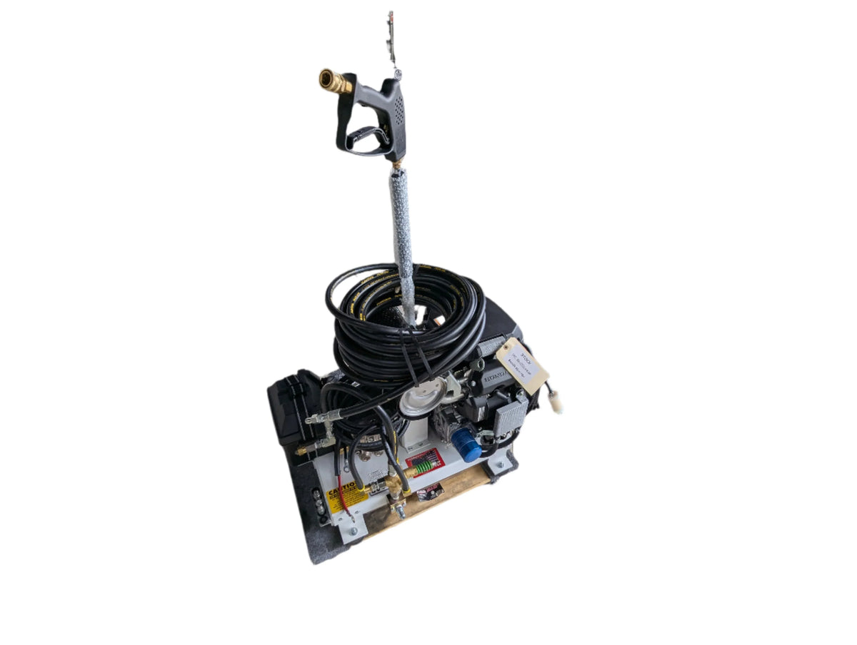 Professional softwash equipment with pressure washer gun, coiled hose, and pump system for exterior cleaning