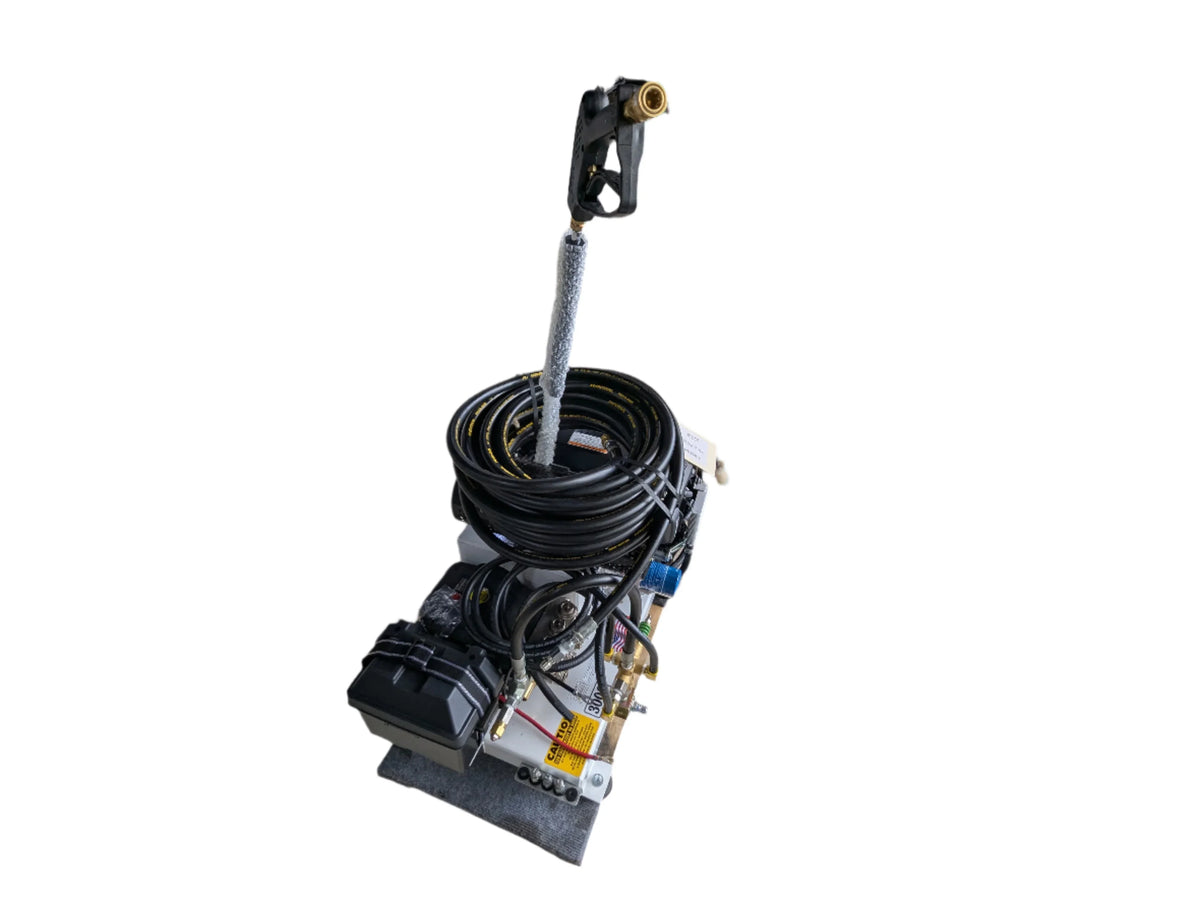 Professional softwash equipment with pressure washer gun, coiled hose, and pump system for exterior cleaning