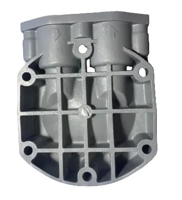 Grey softwash pump housing with mounting holes and flow ports for pressure washing equipment