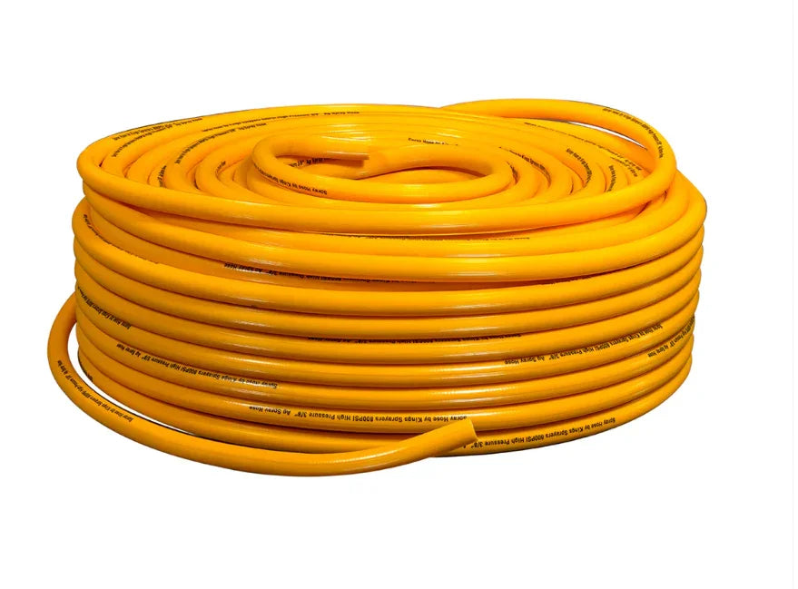 Bright yellow coiled high-pressure softwash hose for professional cleaning equipment
